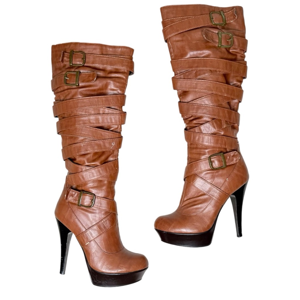 Brown stiletto boots with gold hardware detailing.